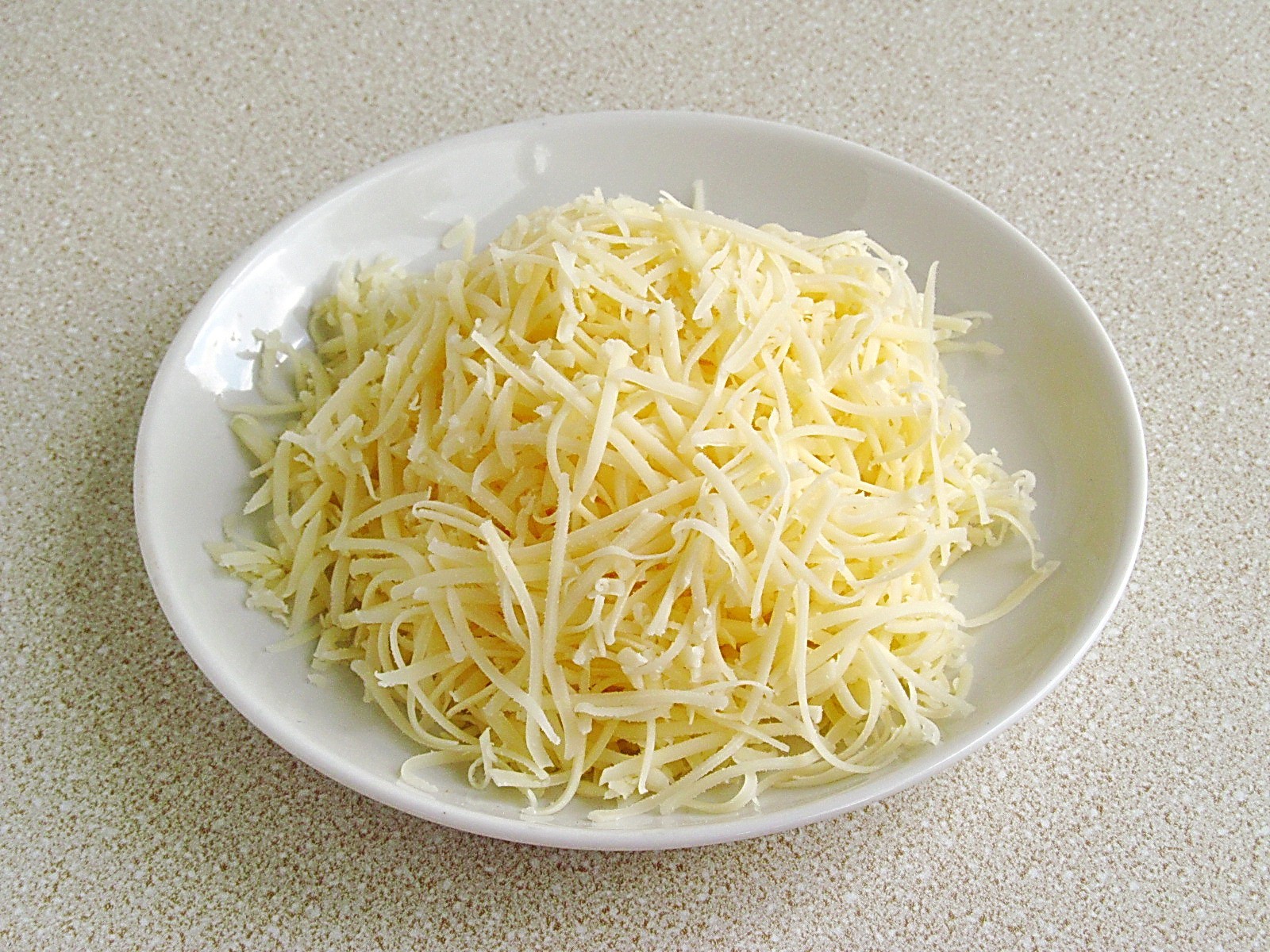 Шаг 5 приготовления Картофель в духовке с сыром и чесноком