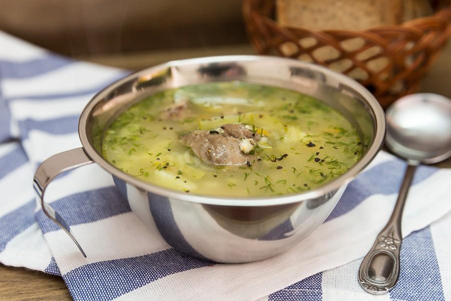 Фото рецепта Рассольник со свининой с солеными огурцами на перловой крупе